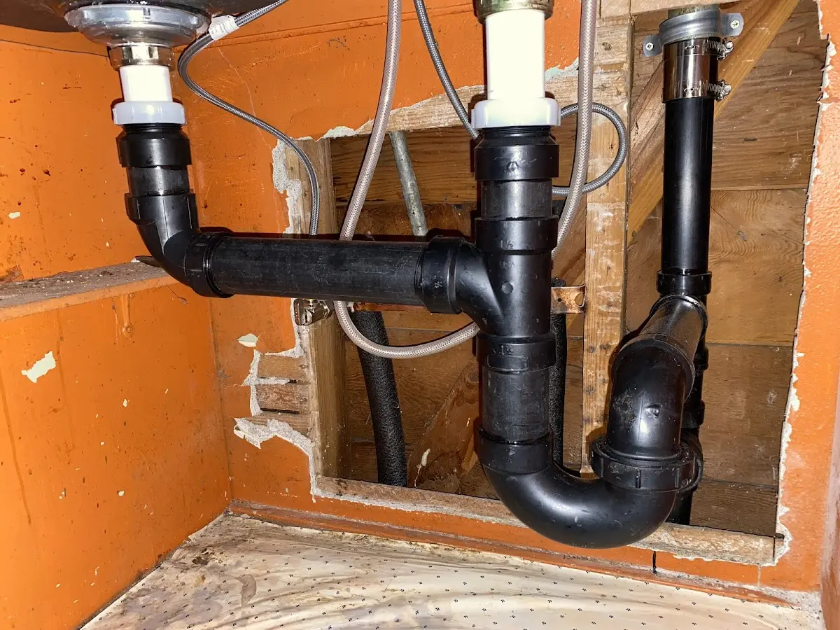 Professional Garbage Disposal Repair equipment and tools on the job in South Amboy